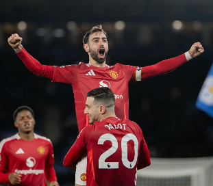 Bruno Fernades jubilating with teammate